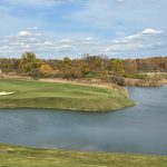 Panoramic view of a lush green golf course at Victoria National Golf Club. Smooth