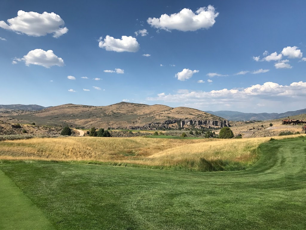 Panoramic view of a lush green golf course at Victory Ranch. Smooth