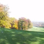 Panoramic view of a lush green golf course at Virtues Golf Club. Smooth