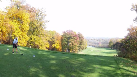 Panoramic view of a lush green golf course at Virtues Golf Club. Smooth