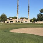 green grass with the flag in the hole.