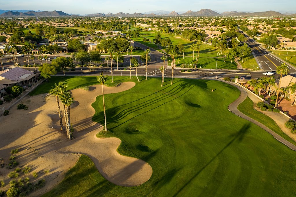 Panoramic view of a lush green golf course at Vistas Course at Westbrook Village Golf Club. Smooth