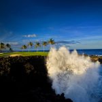 Panoramic view of a lush green golf course at Waikoloa Beach Resort Golf. Smooth