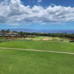 Panoramic view of a lush green golf course at Wailea Blue Golf Course. Smooth