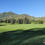 Panoramic view of a lush green golf course at Wasatch Mountain Golf Course. Smooth