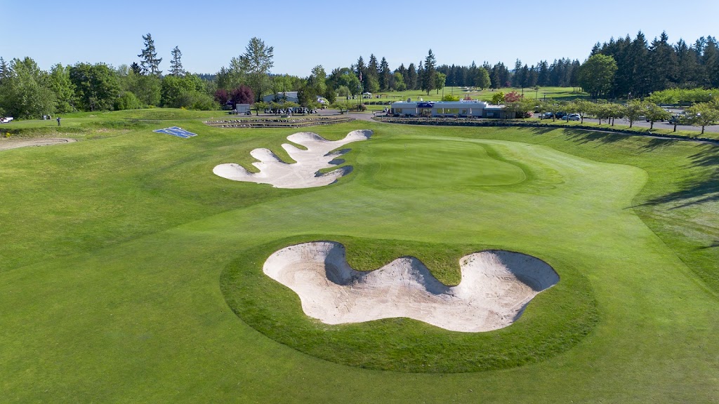 Panoramic view of a lush green golf course at Washington National Golf Club. Smooth