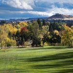 Panoramic view of a lush green golf course at Washoe County Golf Course. Smooth