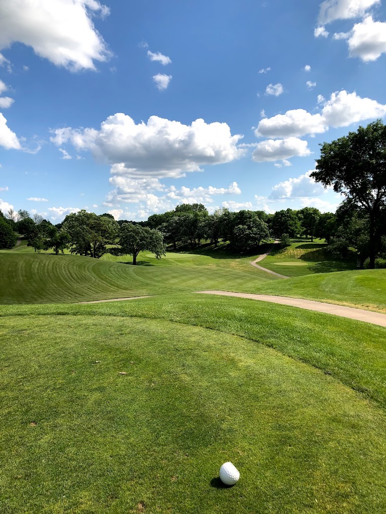 Panoramic view of a lush green golf course at Waveland Golf Course. Smooth