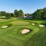 Panoramic view of a lush green golf course at Waverly Woods Golf Club. Smooth