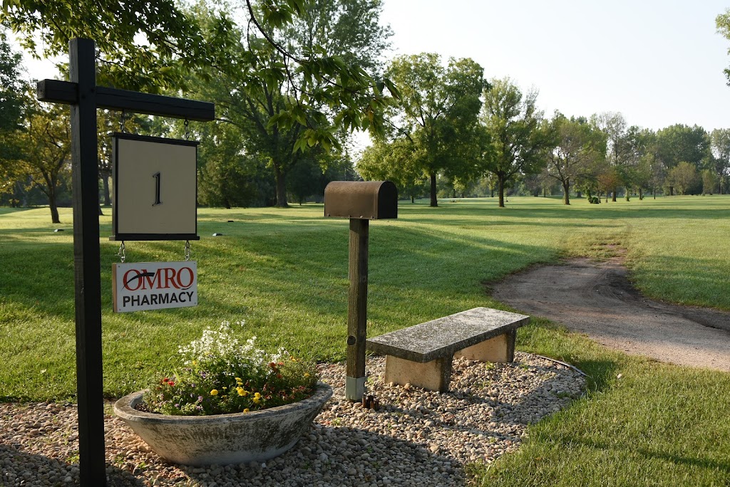 Panoramic view of a lush green golf course at Wedgewood Golf Course & Grill. Smooth