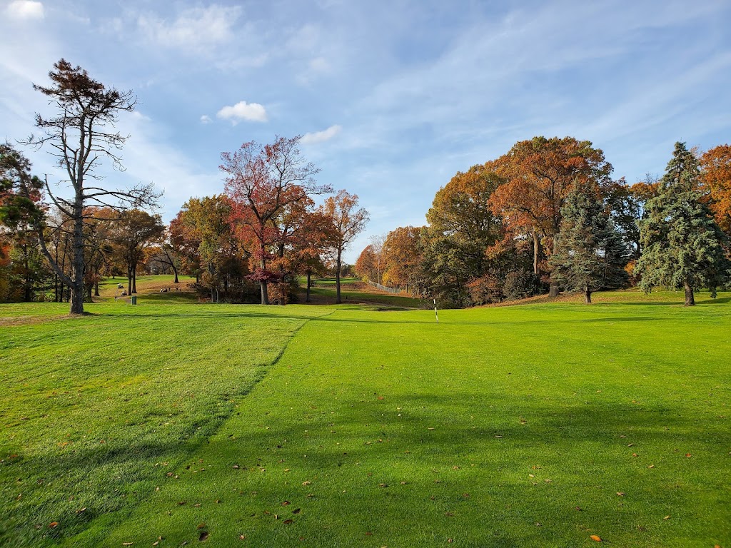 Panoramic view of a lush green golf course at Weequahic Golf Course. Smooth