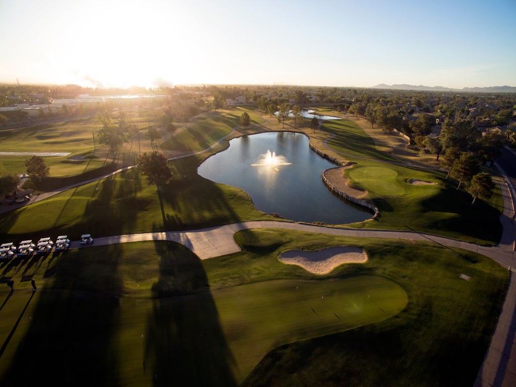 Panoramic view of a lush green golf course at Western Skies Golf Club. Smooth