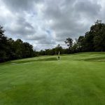 Panoramic view of a lush green golf course at Westfields Golf Club. Smooth