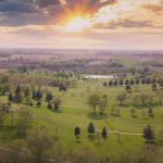 Panoramic view of a lush green golf course at Westwood Golf Course. Smooth