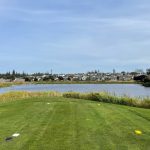 Panoramic view of a lush green golf course at Whidbey Golf Club. Smooth