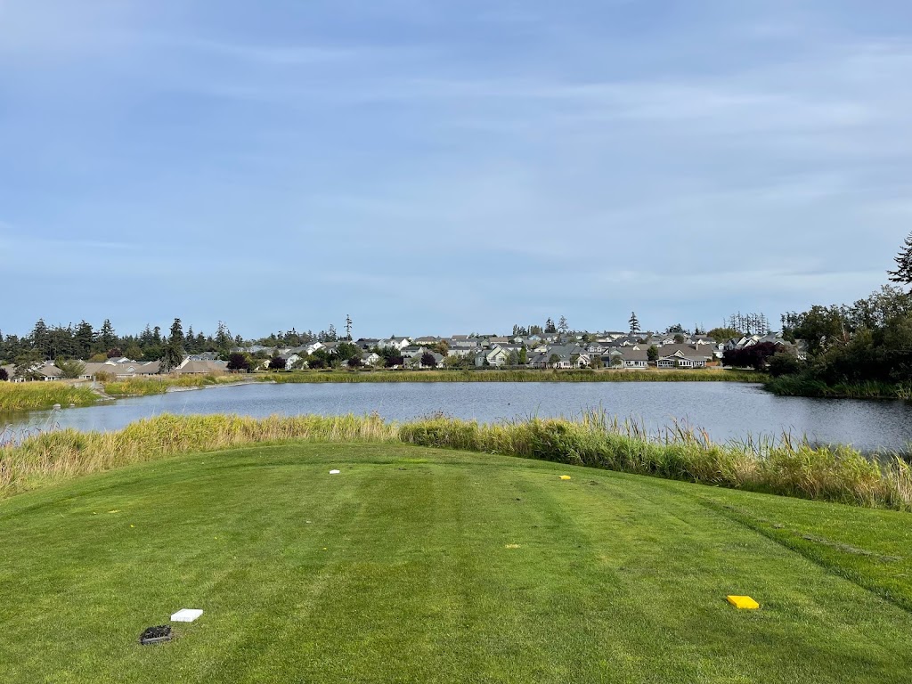 Panoramic view of a lush green golf course at Whidbey Golf Club. Smooth