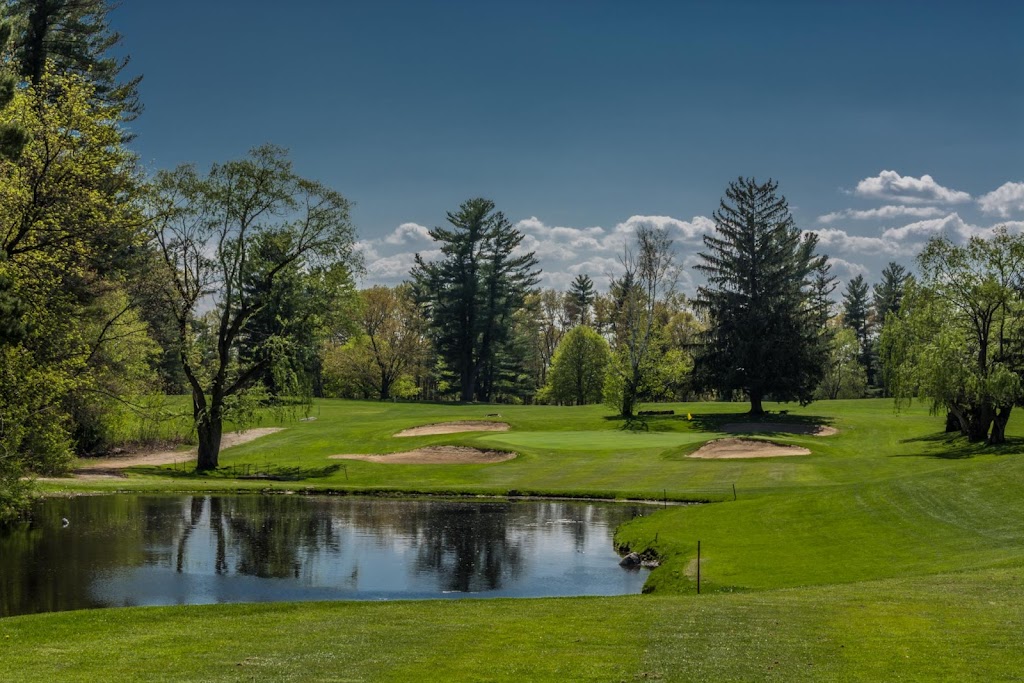 Panoramic view of a lush green golf course at Whip Poor Will Golf Club. Smooth