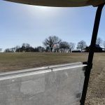 Panoramic view of a lush green golf course at Whippoorwill Golf Course. Smooth