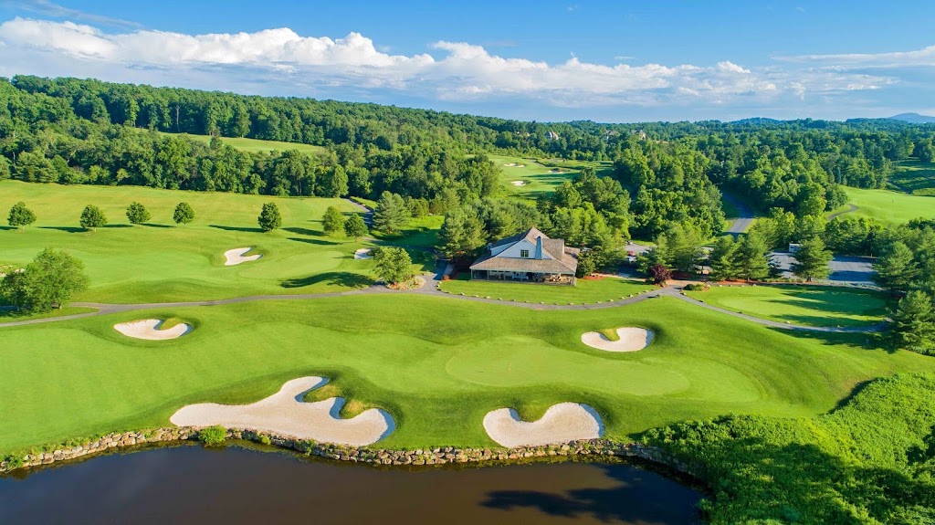 Panoramic view of a lush green golf course at Whiskey Creek Golf Club. Smooth