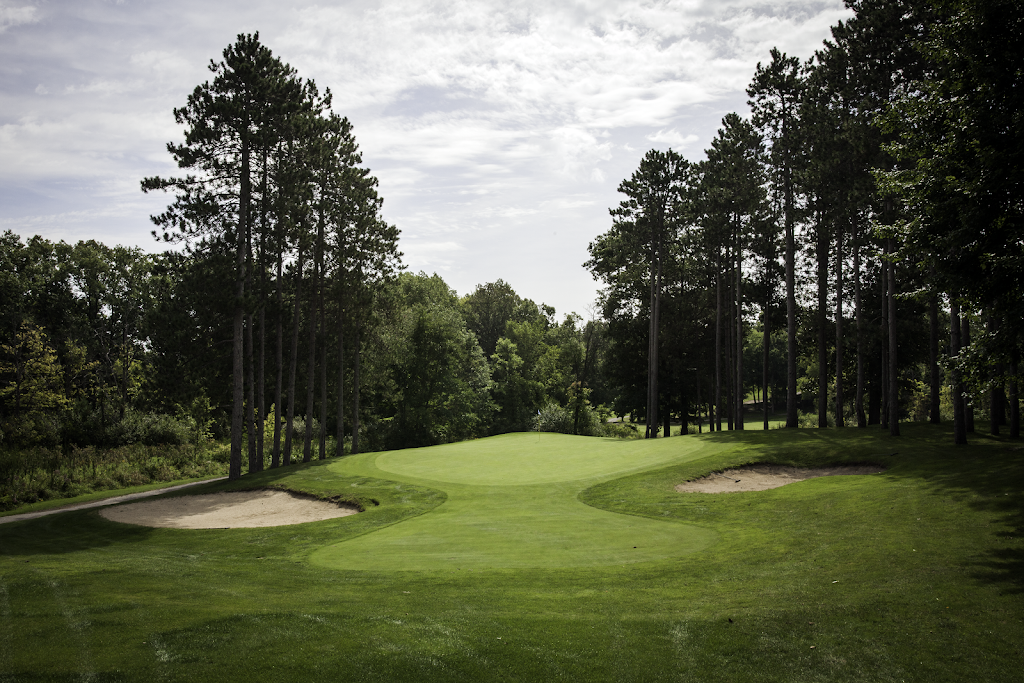 Panoramic view of a lush green golf course at Whispering Pines Golf Club & Banquet Hall. Smooth