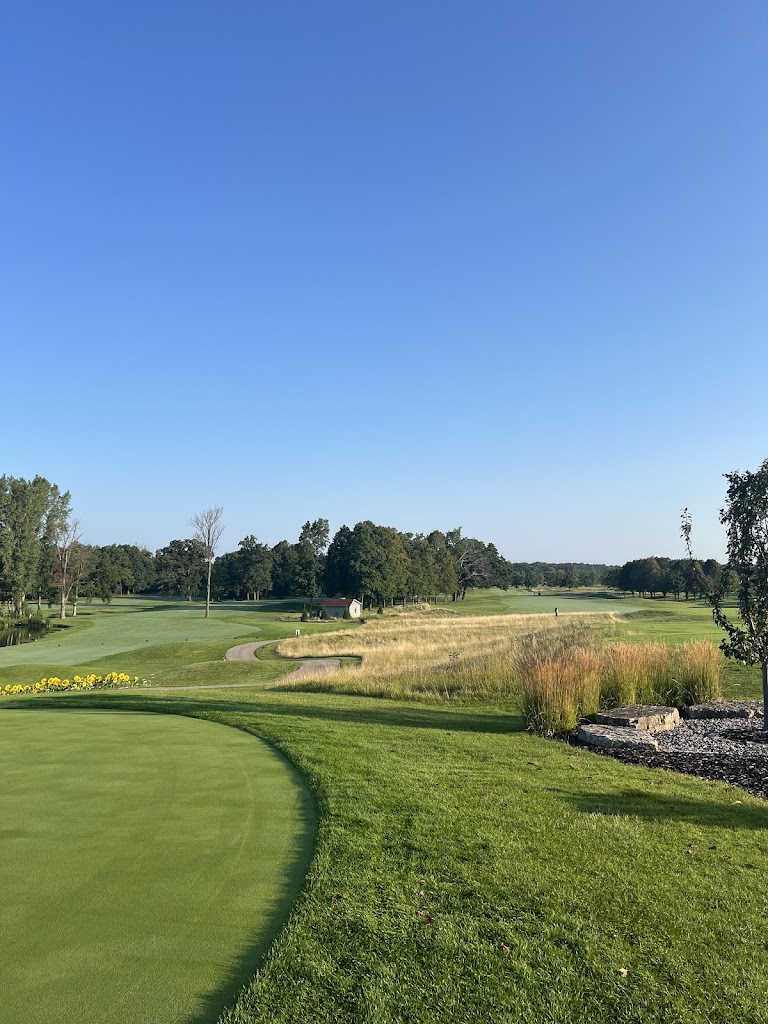 Panoramic view of a lush green golf course at Whispering Springs Golf Club. Smooth