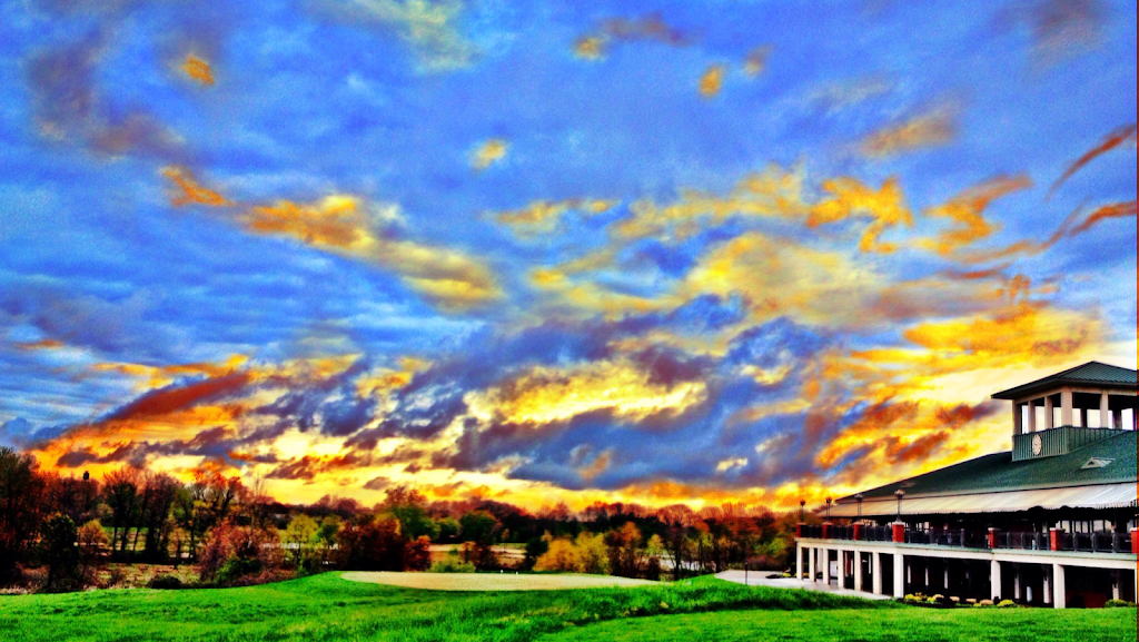 Panoramic view of a lush green golf course at White Clay Creek Country Club. Smooth