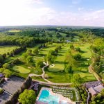 Panoramic view of a lush green golf course at White Manor Country Club. Smooth