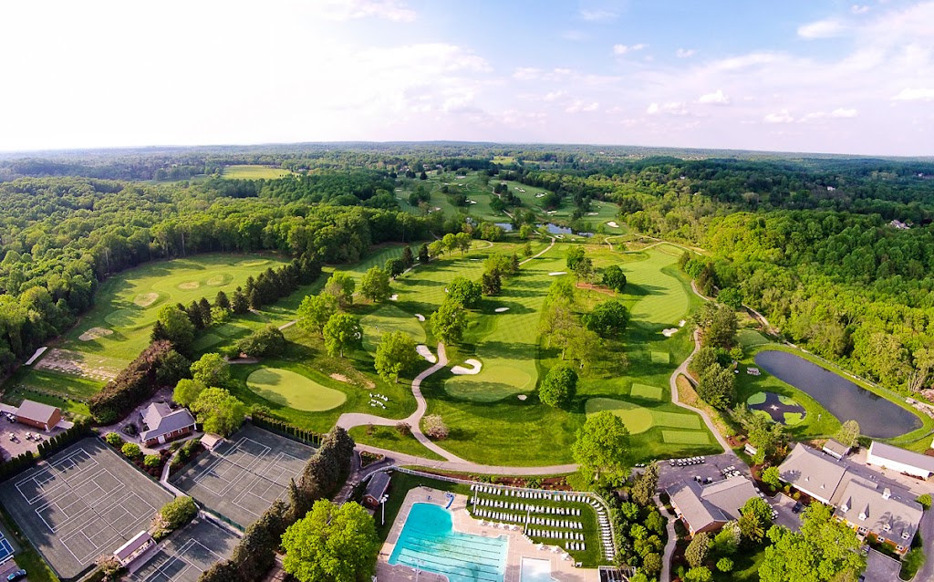 Panoramic view of a lush green golf course at White Manor Country Club. Smooth