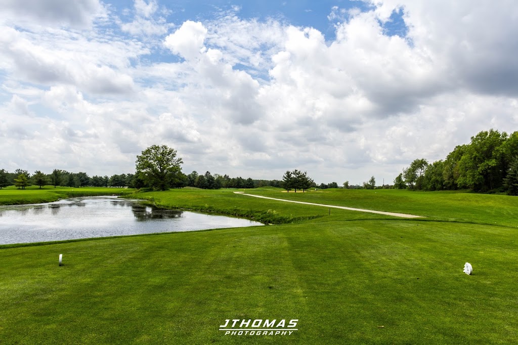 Panoramic view of a lush green golf course at White Pines Golf Course. Smooth