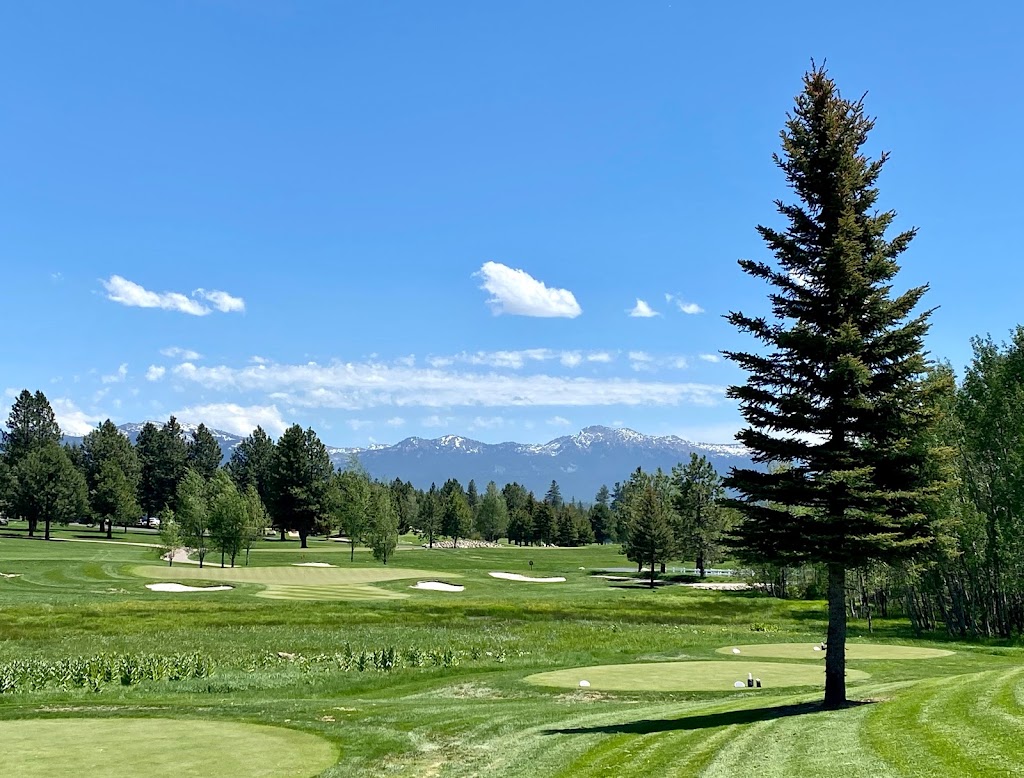 Panoramic view of a lush green golf course at Whitetail Club. Smooth