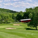 Panoramic view of a lush green golf course at Whitetail Golf Club. Smooth