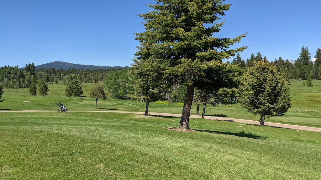 Panoramic view of a lush green golf course at Whitetail Golf Club. Smooth