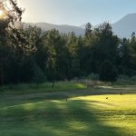 Panoramic view of a lush green golf course at Whitetail Golf Course. Smooth