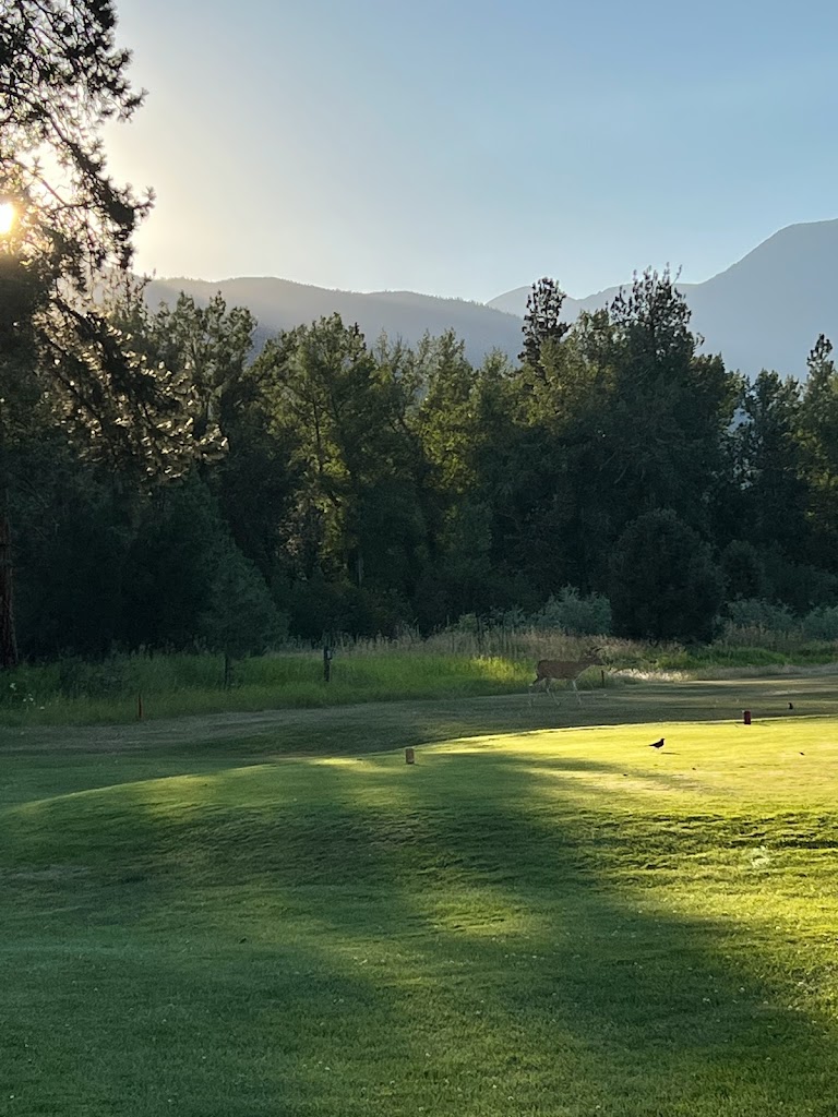 Panoramic view of a lush green golf course at Whitetail Golf Course. Smooth