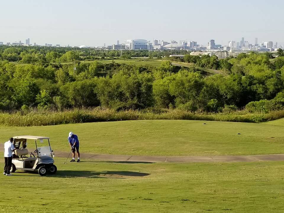 Panoramic view of a lush green golf course at Wildcat Golf Club. Smooth