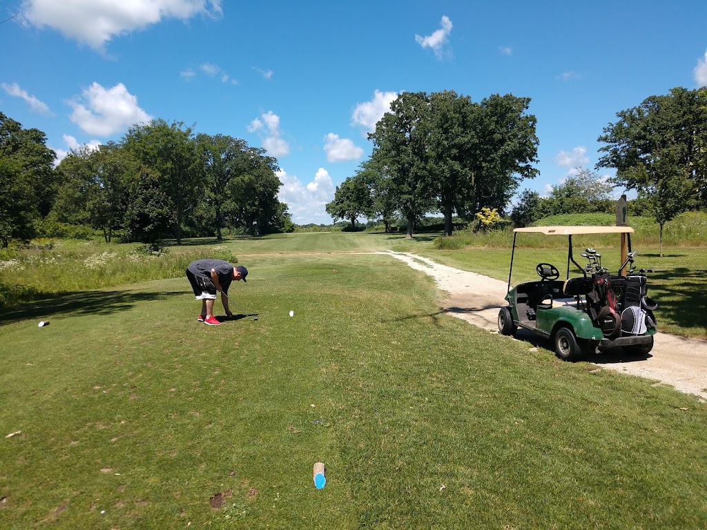 Panoramic view of a lush green golf course at Wildwood Golf Course. Smooth