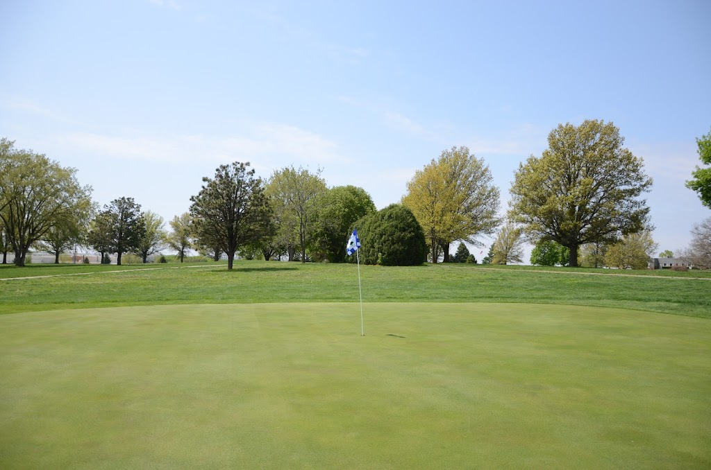 Panoramic view of a lush green golf course at Wildwood Golf Course. Smooth