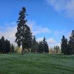 Panoramic view of a lush green golf course at Willamette Valley Country Club. Smooth