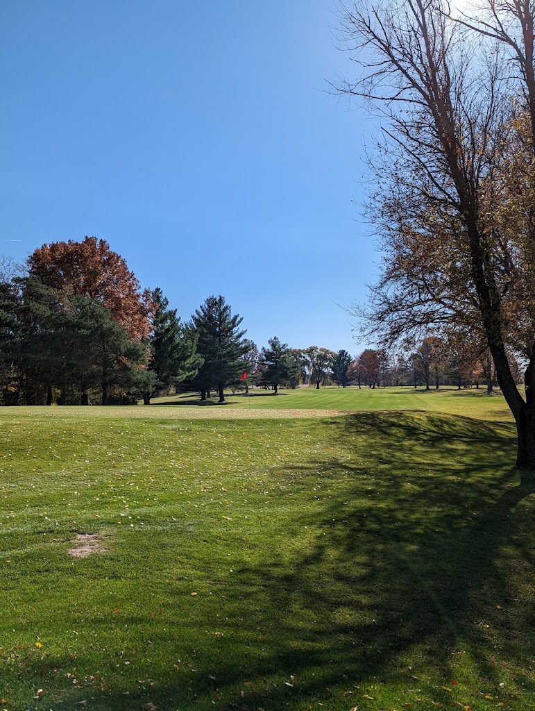 Panoramic view of a lush green golf course at Willow Brook Golf Course. Smooth