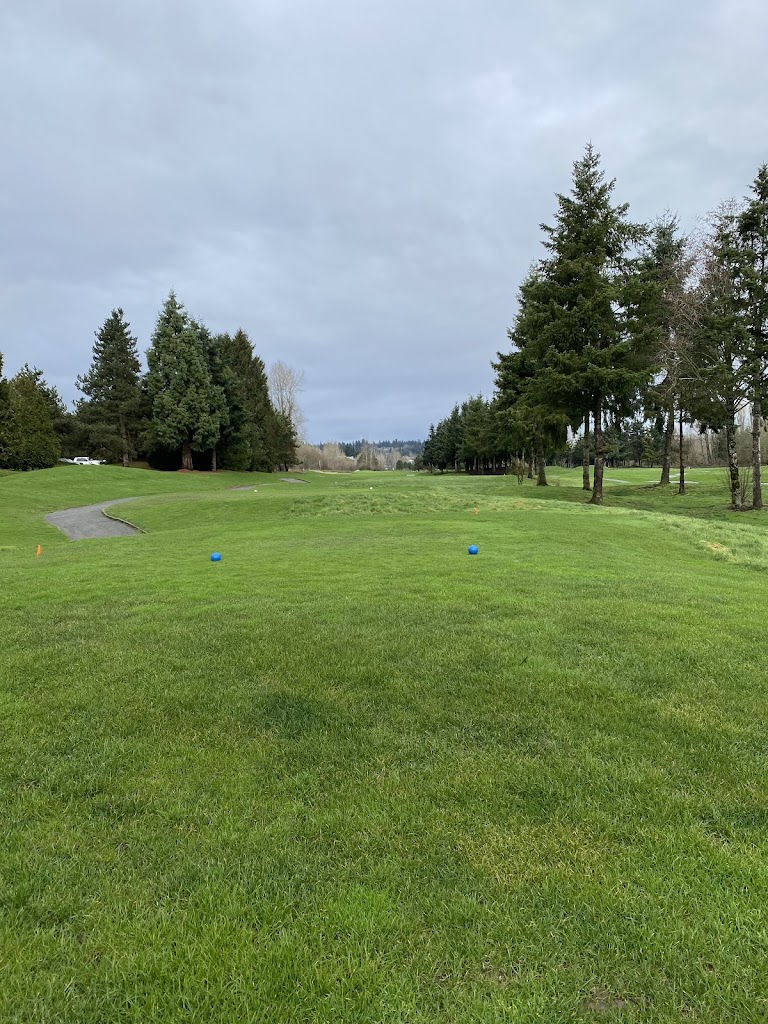 Panoramic view of a lush green golf course at Willows Run Golf Complex. Smooth