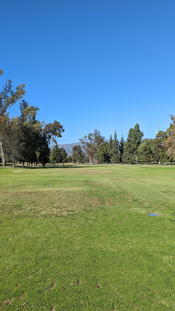 Panoramic view of a lush green golf course at Wilson & Harding Golf Courses. Smooth