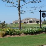 Panoramic view of a lush green golf course at WinStar Golf Club & Academy. Smooth