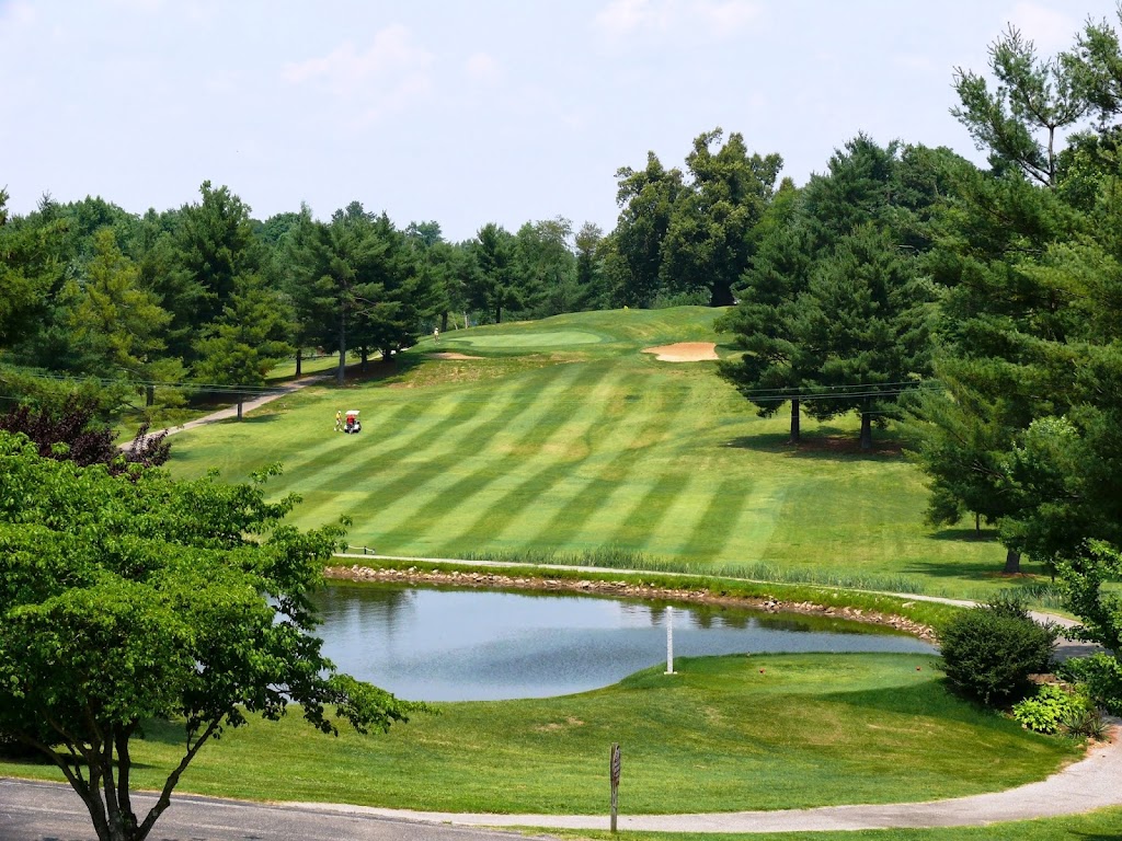 Panoramic view of a lush green golf course at Windridge Country Club. Smooth