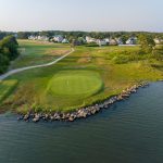 Panoramic view of a lush green golf course at Winnapaug Country Club. Smooth