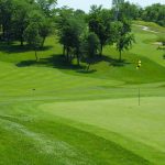 Panoramic view of a lush green golf course at WinterStone Golf Course. Smooth