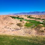 Panoramic view of a lush green golf course at Wolf Creek Golf Club. Smooth