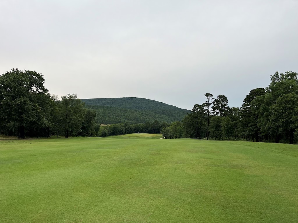 Panoramic view of a lush green golf course at Wolf Mountain. Smooth