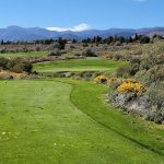 Panoramic view of a lush green golf course at Wolf Run Golf Club. Smooth