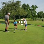 green grass with the flag in the hole.