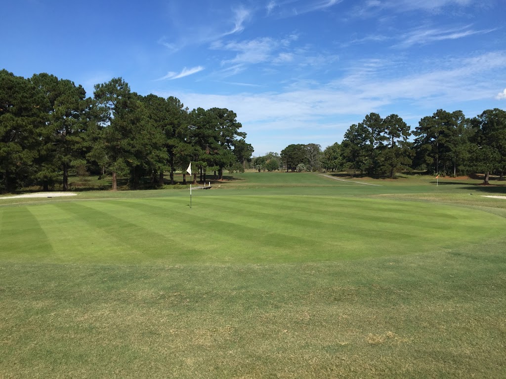 Panoramic view of a lush green golf course at Wrenwoods Golf Course. Smooth